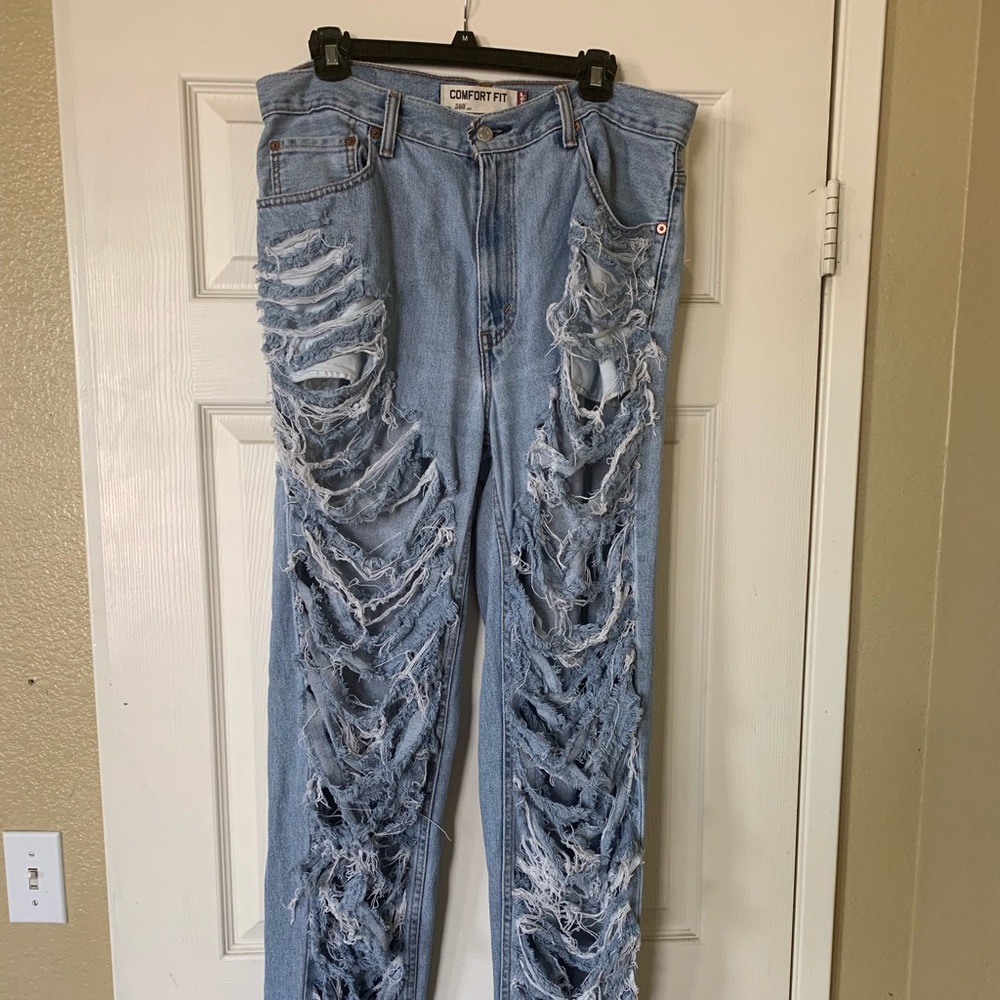 Used custom ripped jeans